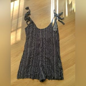 Romper with pockets and adjustable tie straps